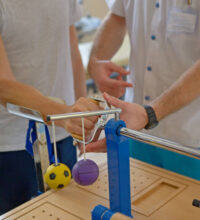 Occupational therapist working on arm exercises with client